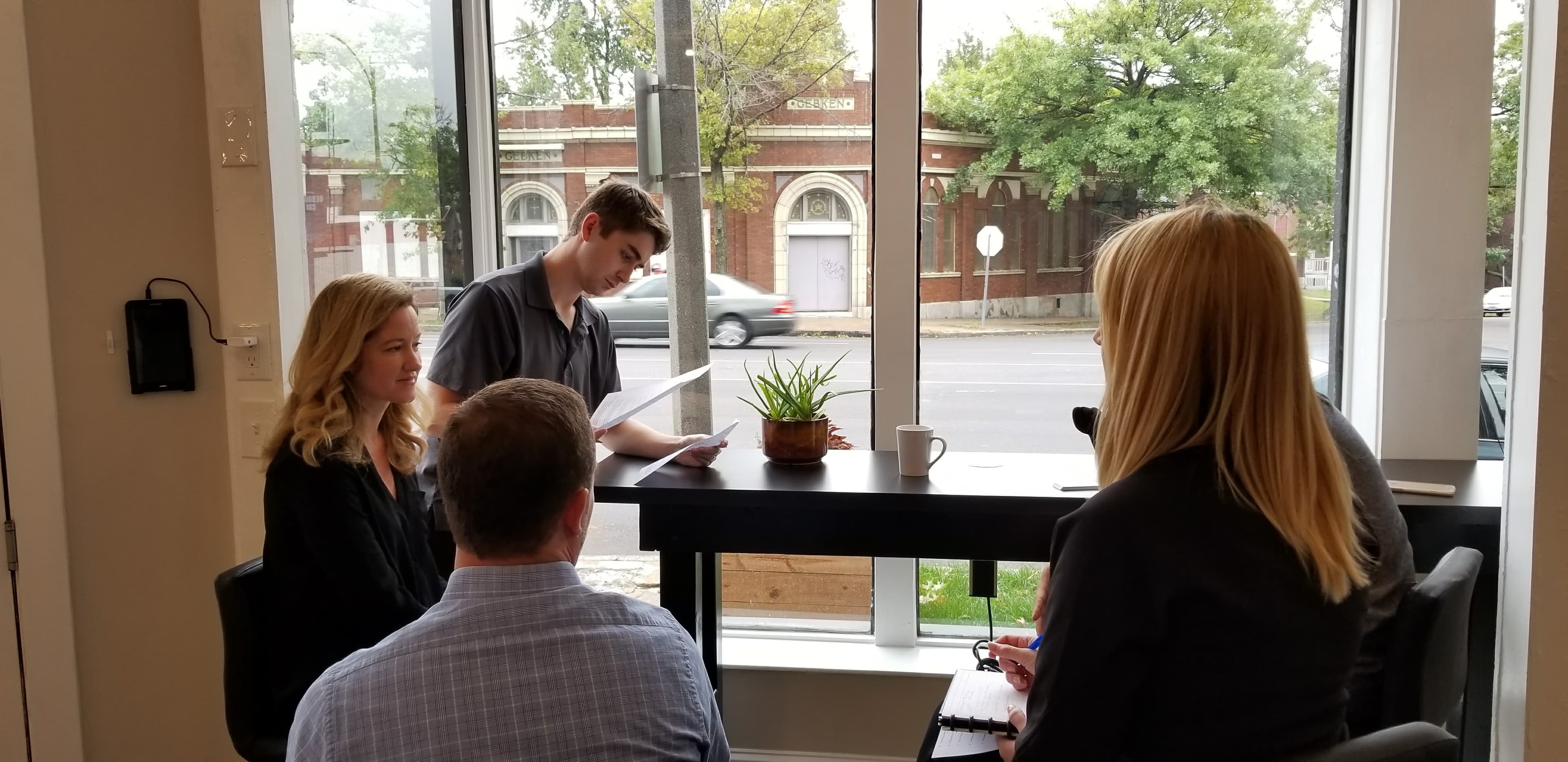 A small group reviewing notes together at a BusinessGPS meeting